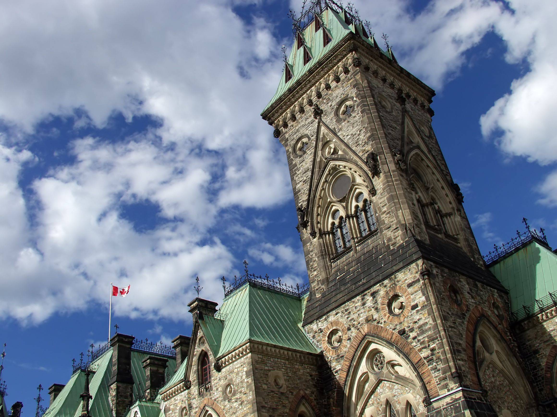 A Gothic Tower Stands Against The Canadian Parliament
