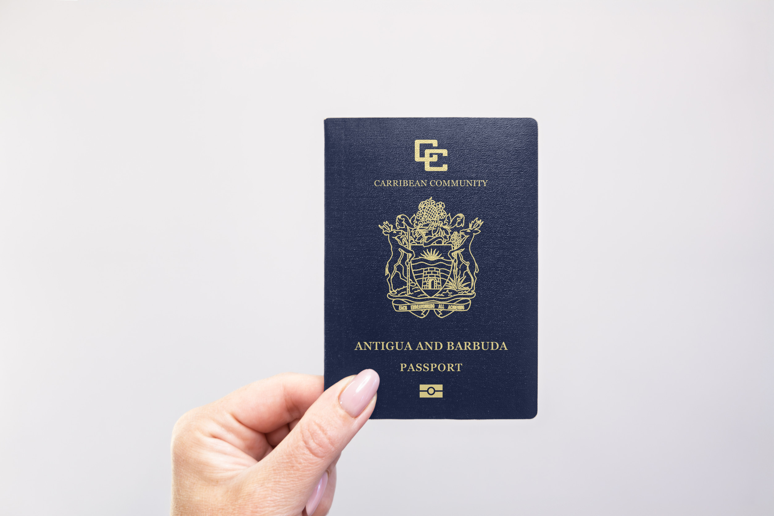 Antigua And Barbuda Passport Held In Hand