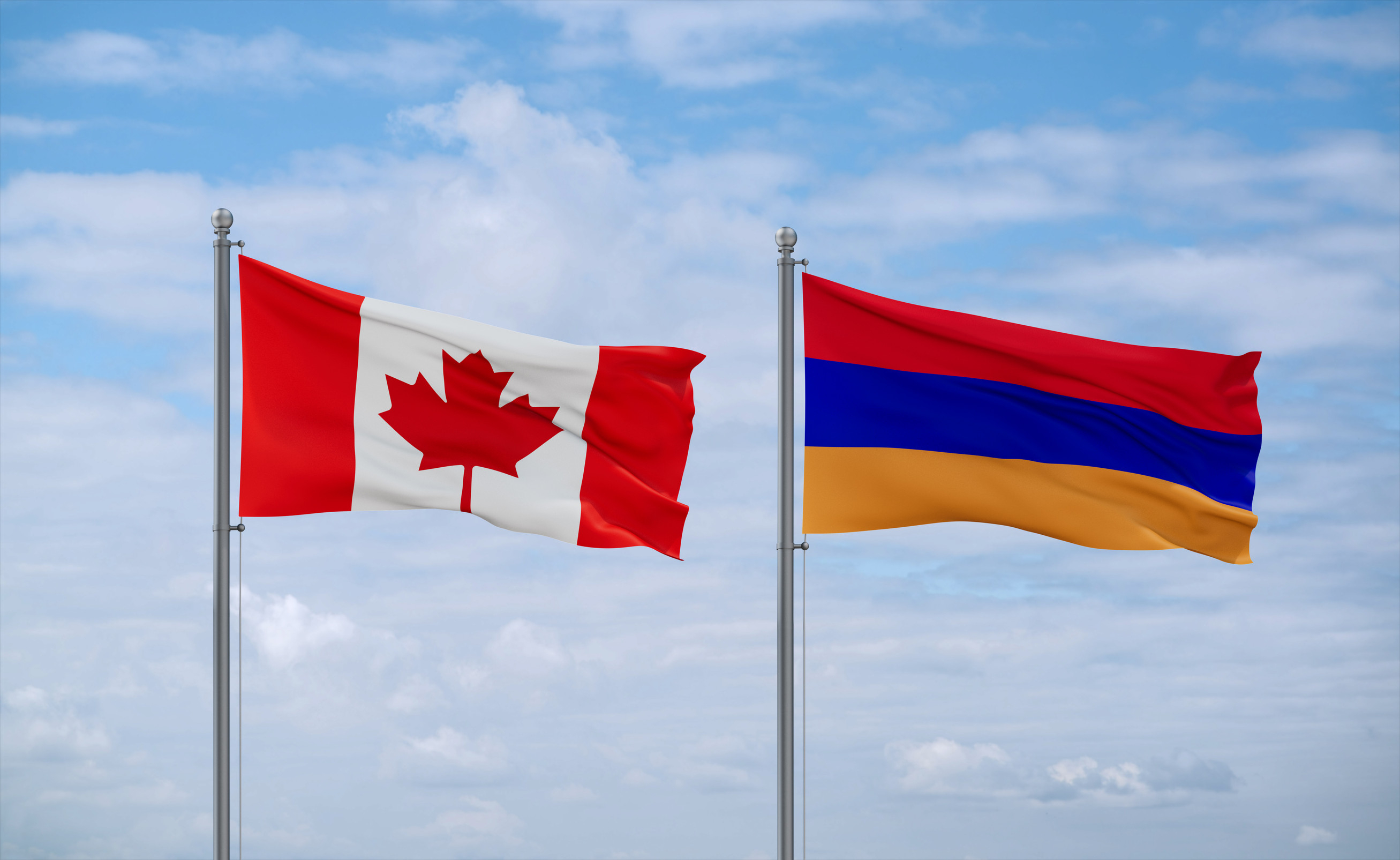 Armenia And Canada Flags Waving Together In The Wind On Blue