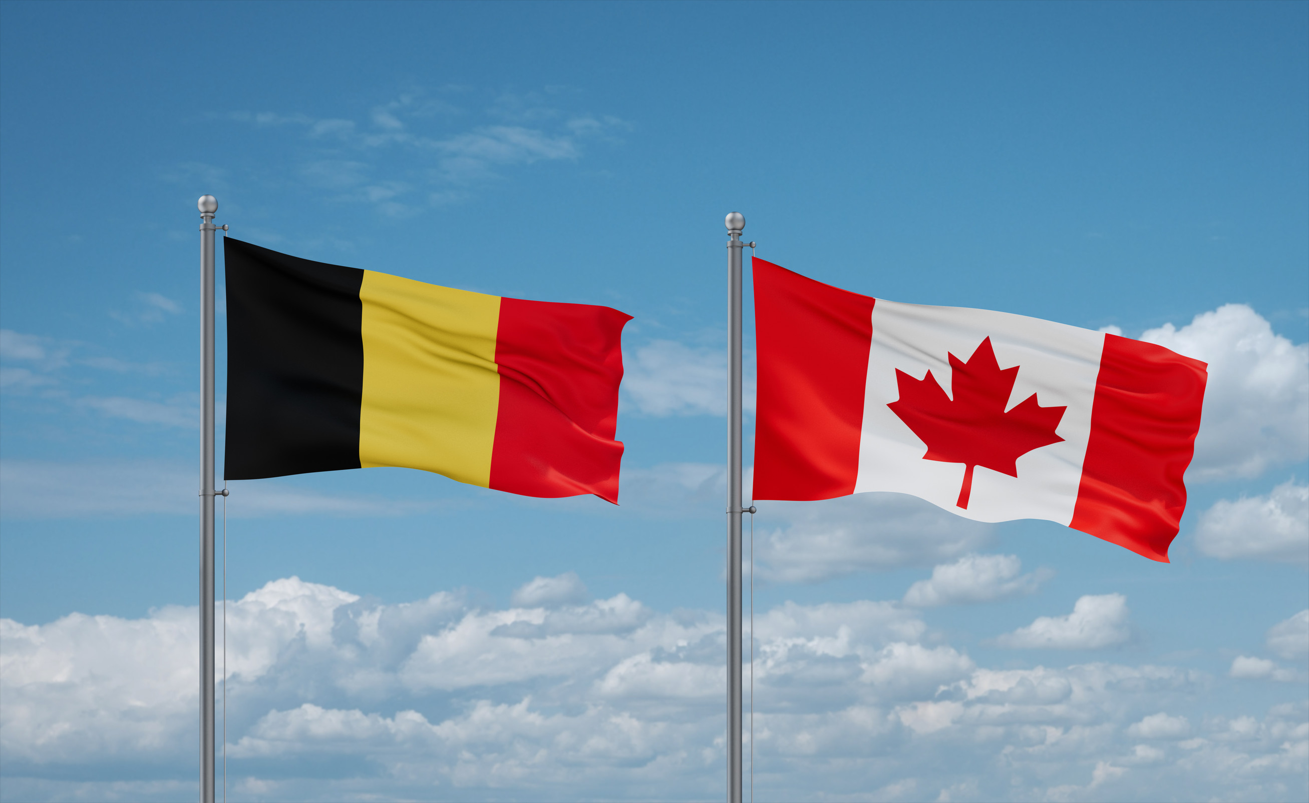 Canada And Belgium Flags Waving Together