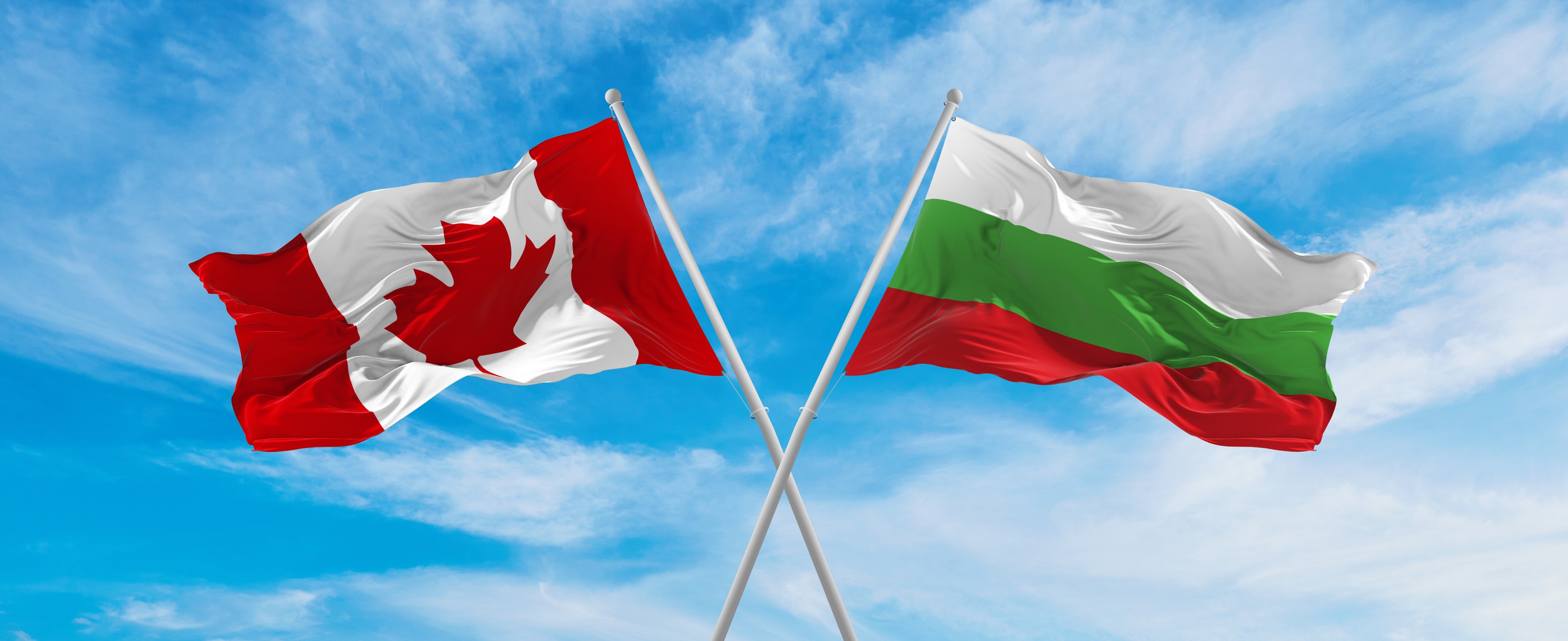 Canada And Bulgaria Flag Waving In The Wind At Cloudy Sky