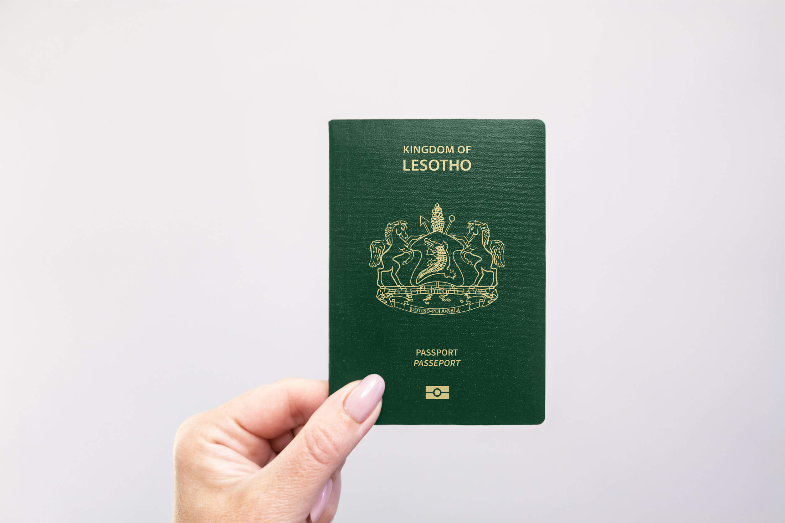 Close Up Of A Lesotho Passport Held In Hand