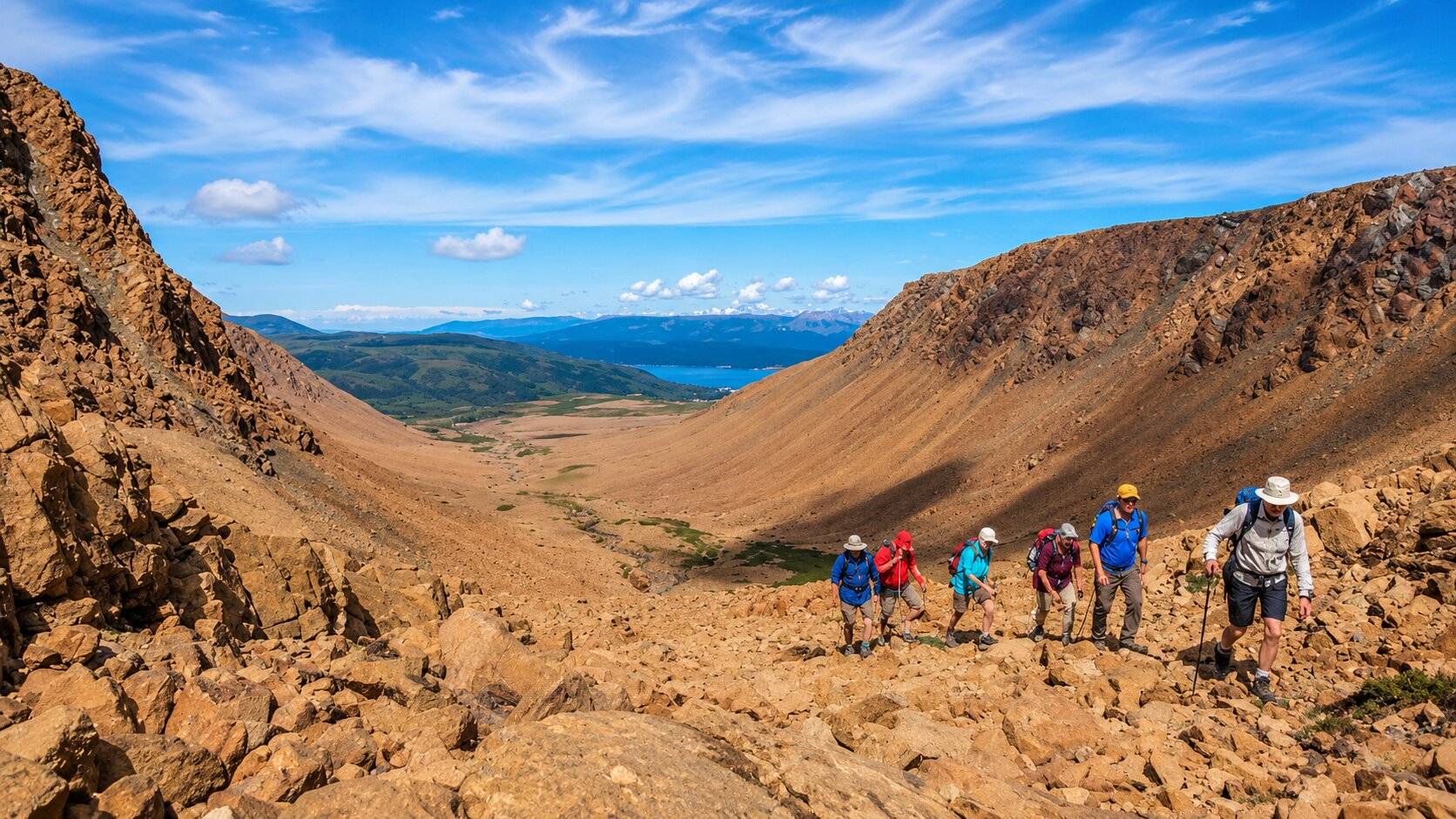 Hikers hiking up a hill in Gros Morne National Park
