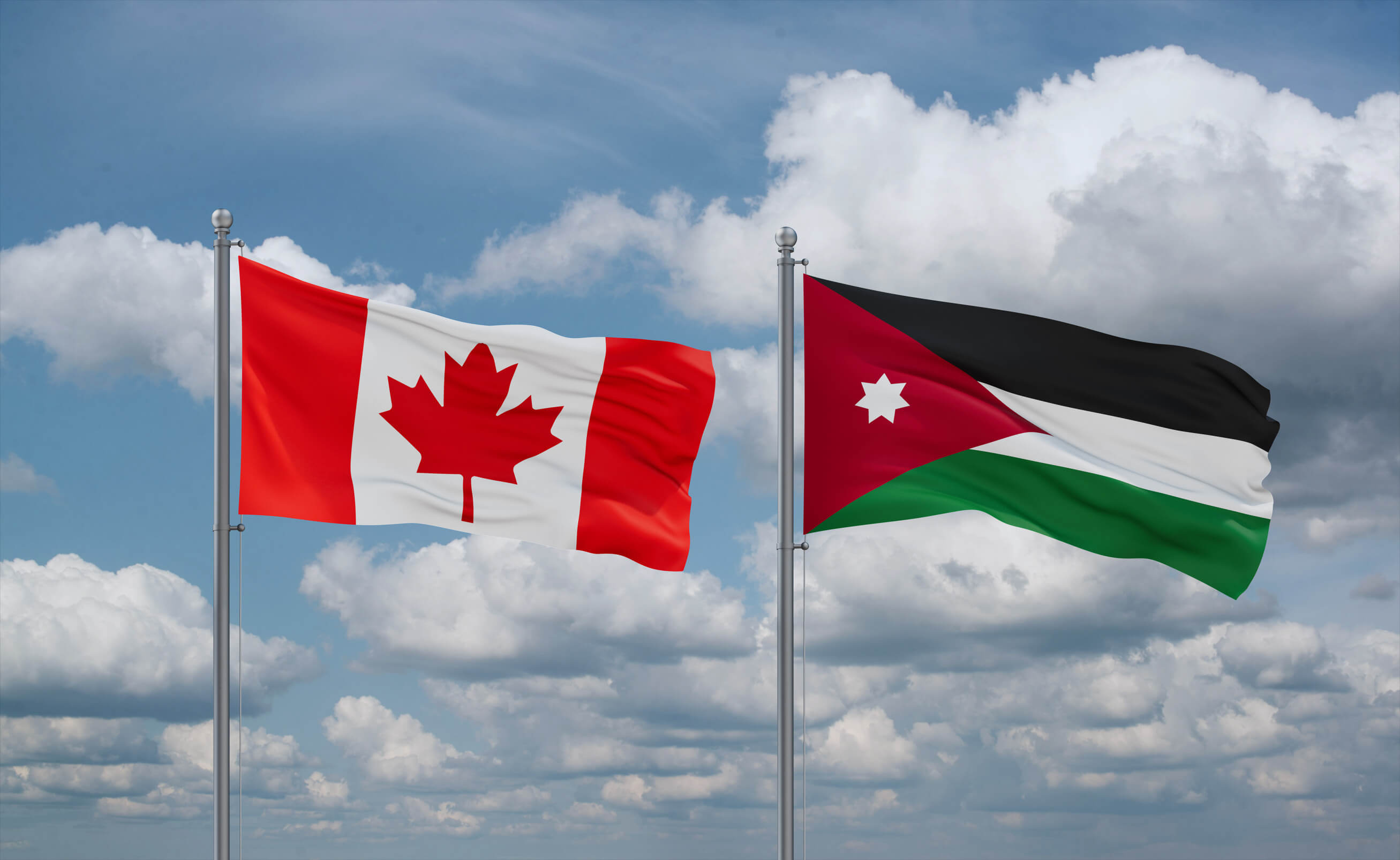 Jordan And Canada Flags Waving Together