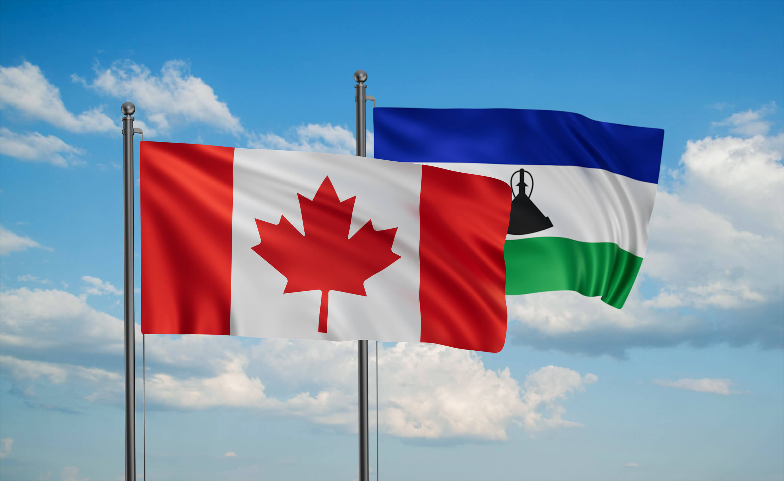Lesotho And Canada Flag Waving Together