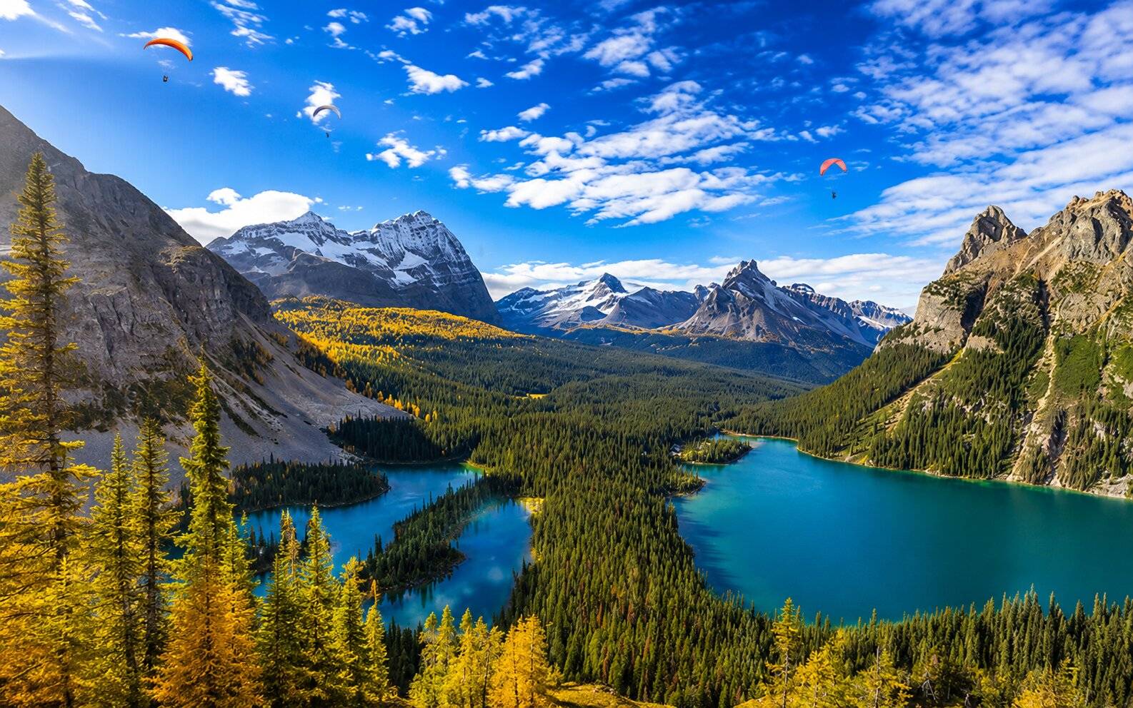 Overview of Yoho National Park with Paragliders in the distance