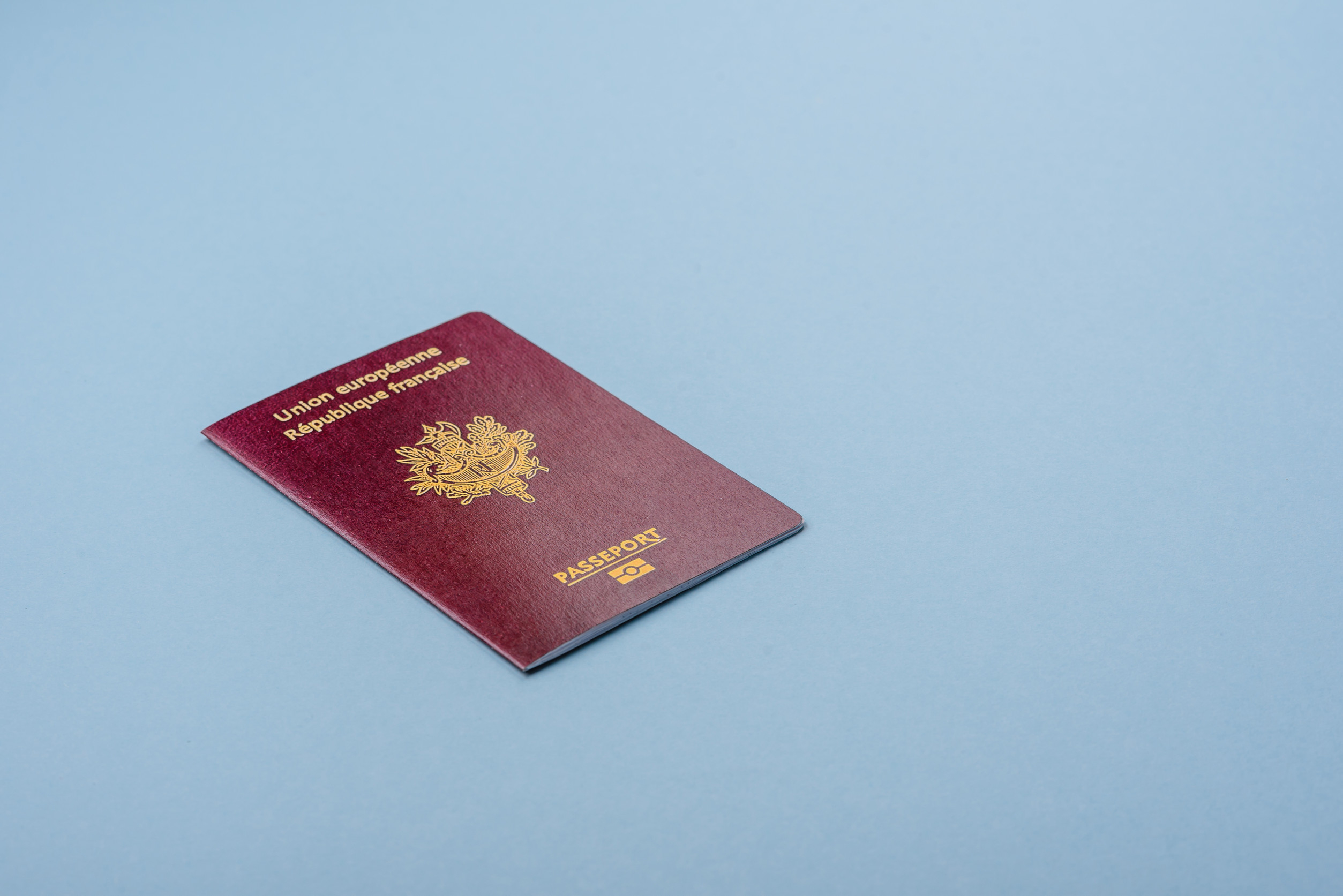 Passport Of The Republic Of France On A Blue Background