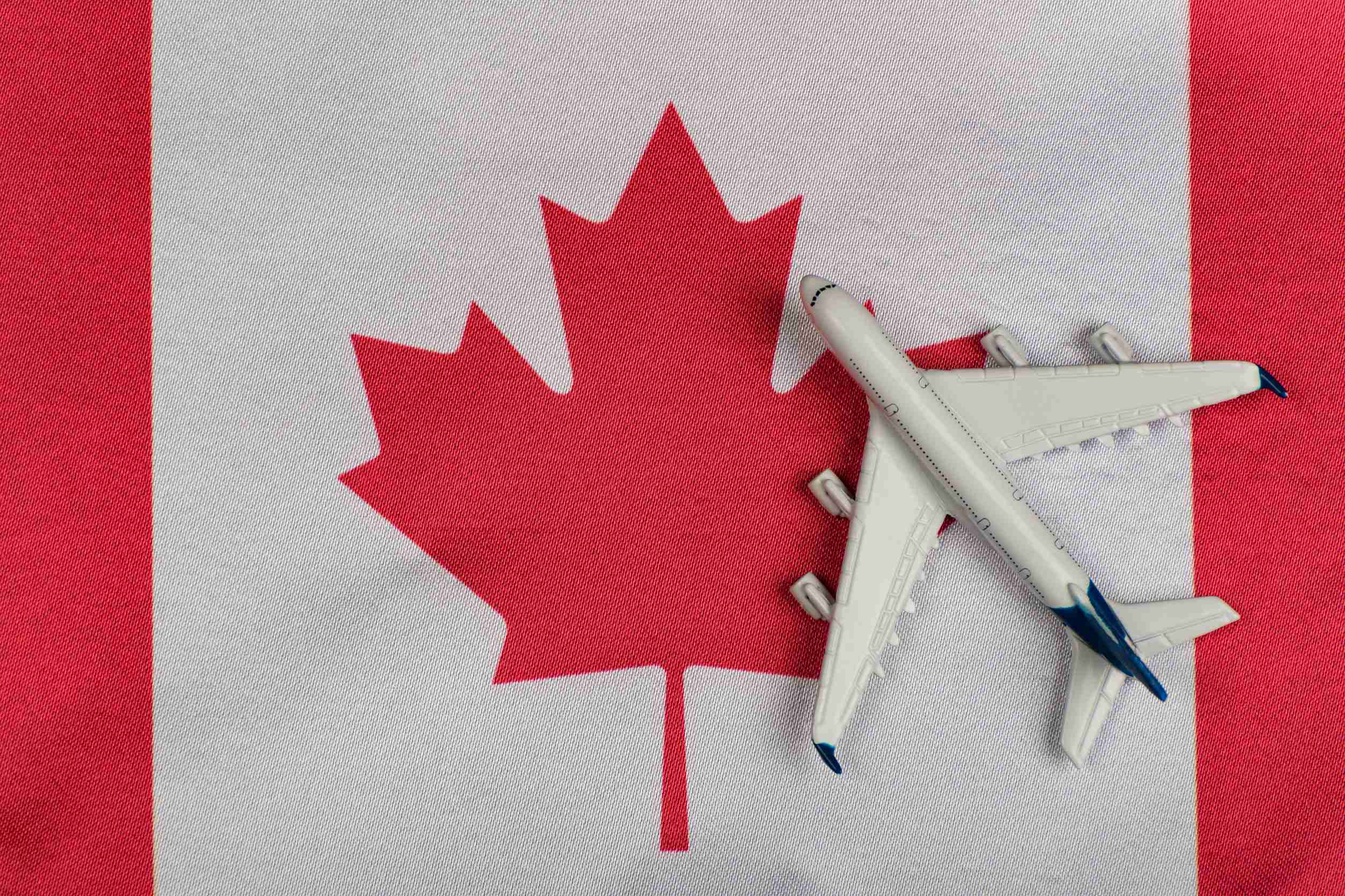 Plane Over The Flag Of Canada