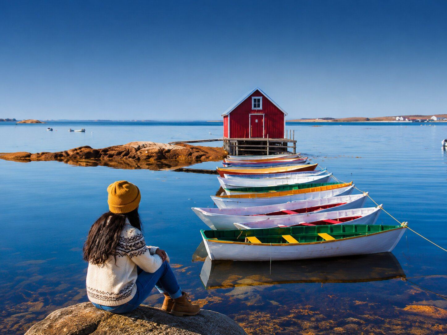 Serene lakeside view with colorful boats